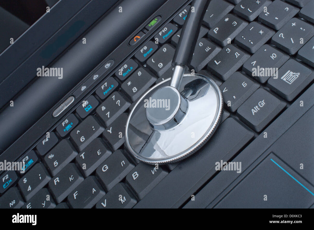 Medical stethoscope laying on a computer keyboard Stock Photo - Alamy