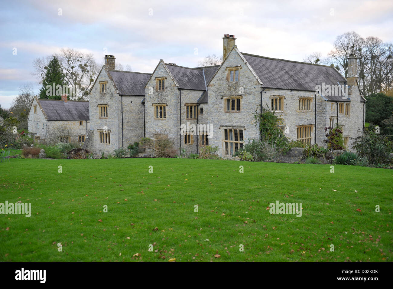 A rural country house in the English countryside that includes architectural features and grounds Stock Photo