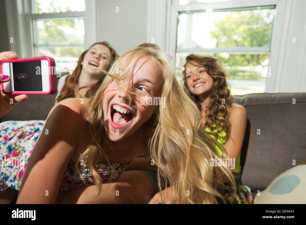 Group of girls being photographed with camera phone Stock Photo - Alamy