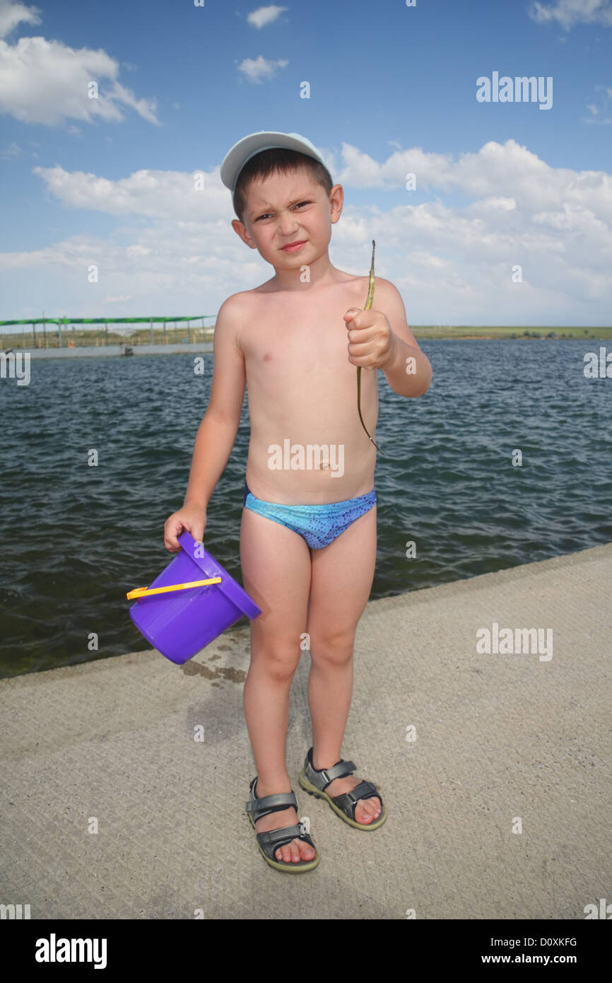 Boy with pipefish Stock Photo