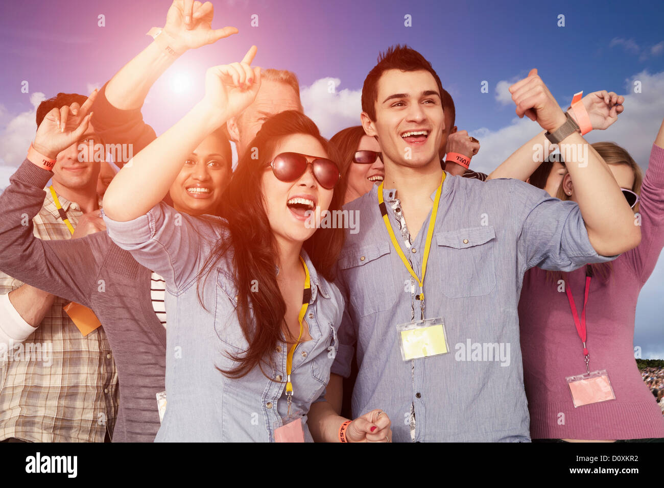 People cheering at a music festival Stock Photo