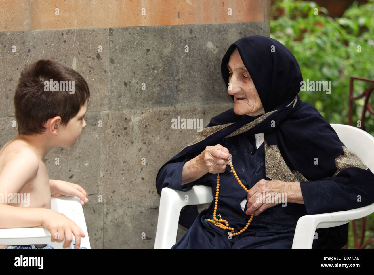 Kid chatting with granny Stock Photo
