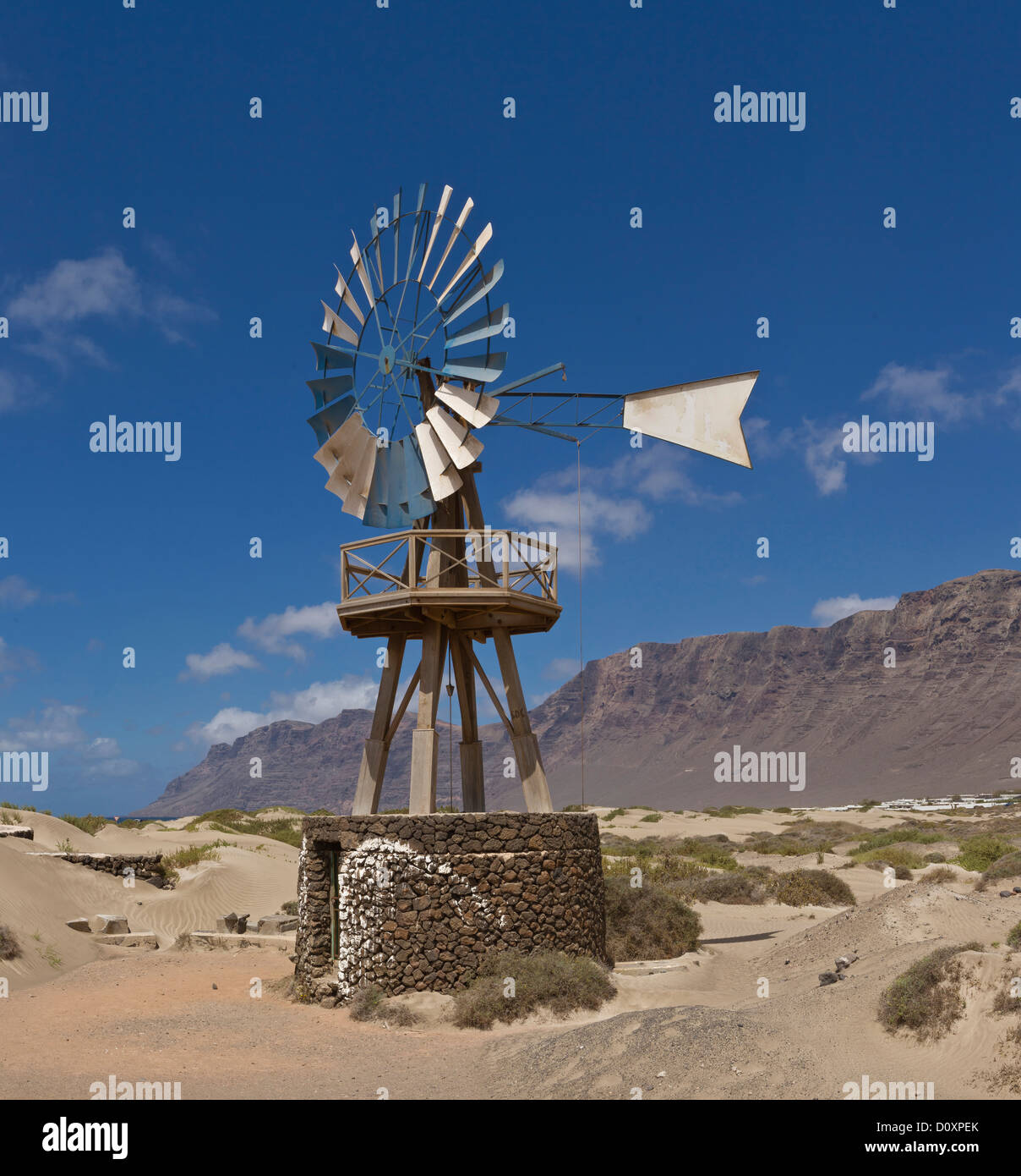 Spain, Lanzarote, Playa de Famara, American windmill, landscape, summer, mountains, hills, Canary Islands, Stock Photo