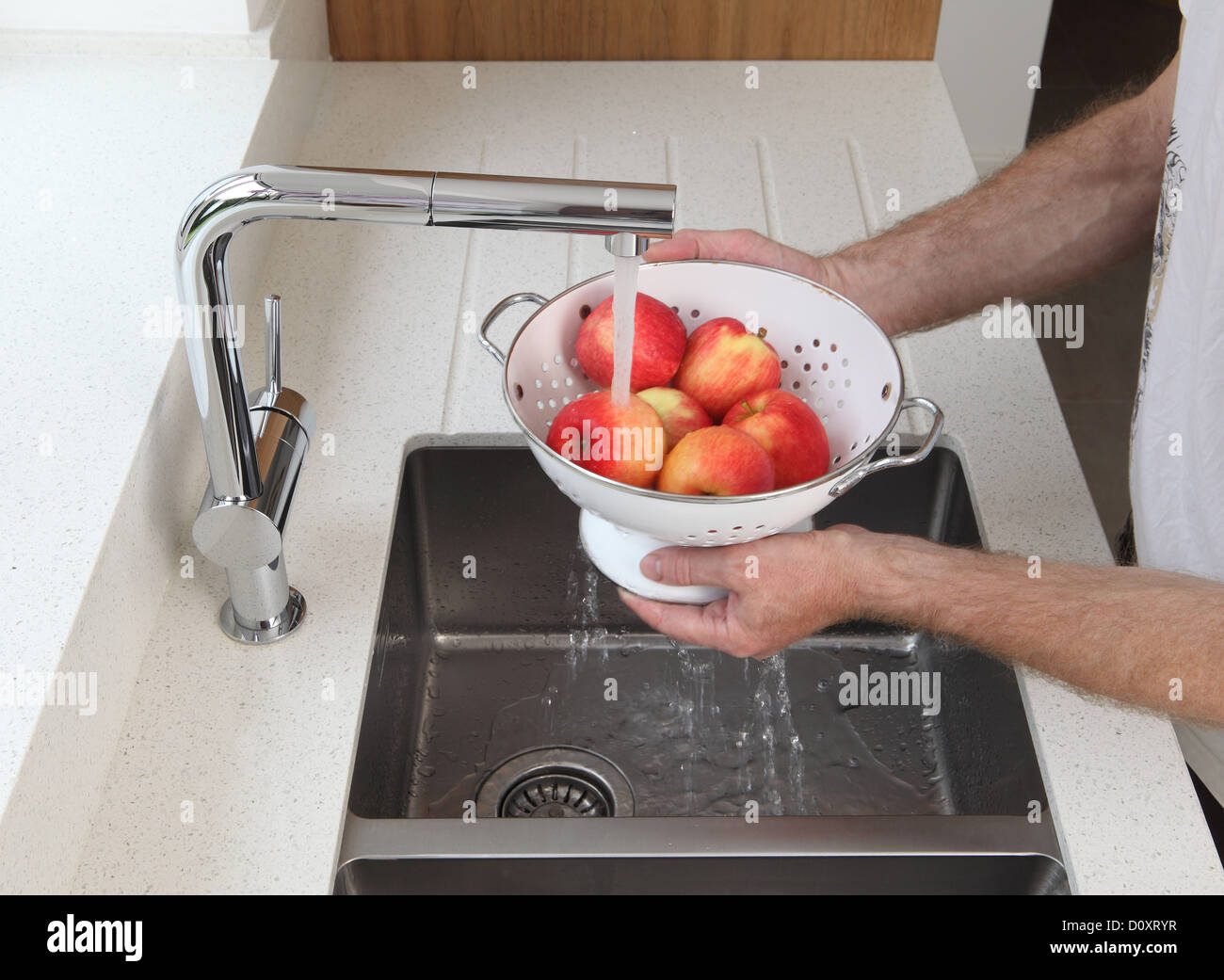 Man washing apples Stock Photo - Alamy