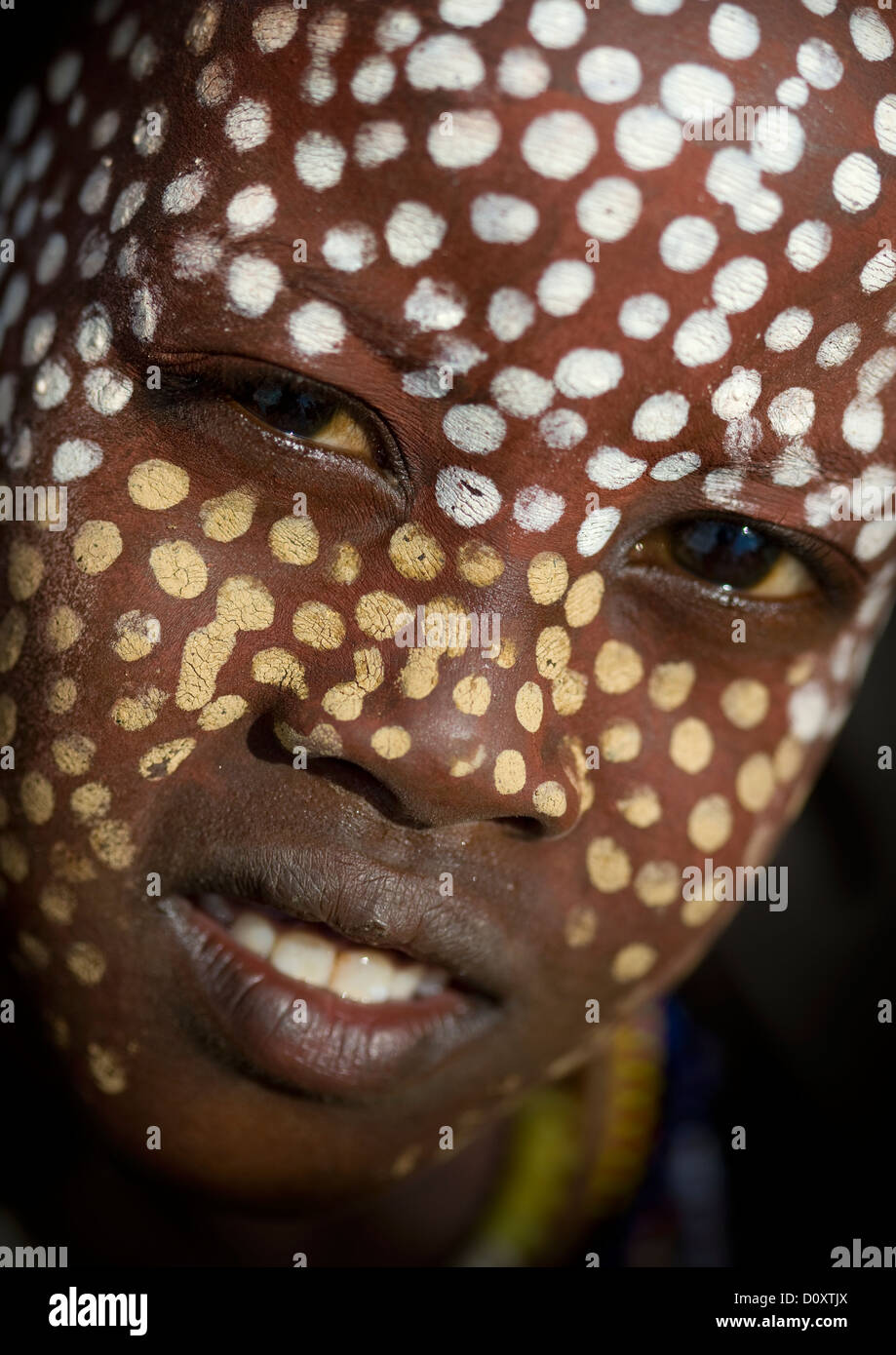 Close Up Portrait Of Erbore Tribe Boy With Face Paint And Toothy Smile, Weito, Omo Valley, Ethiopia Stock Photo
