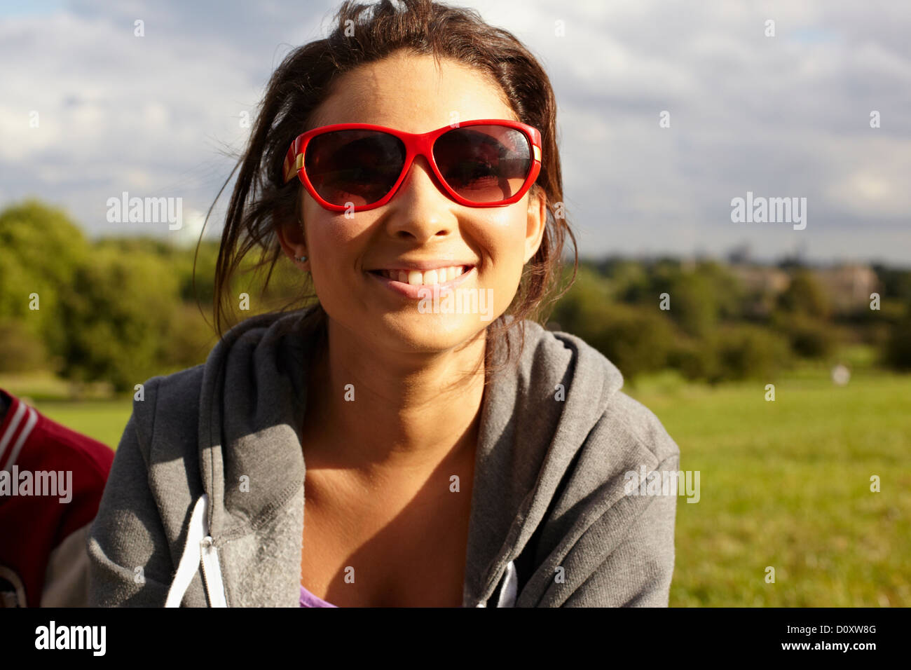 Teenage girl in sunglasses in the park Stock Photo