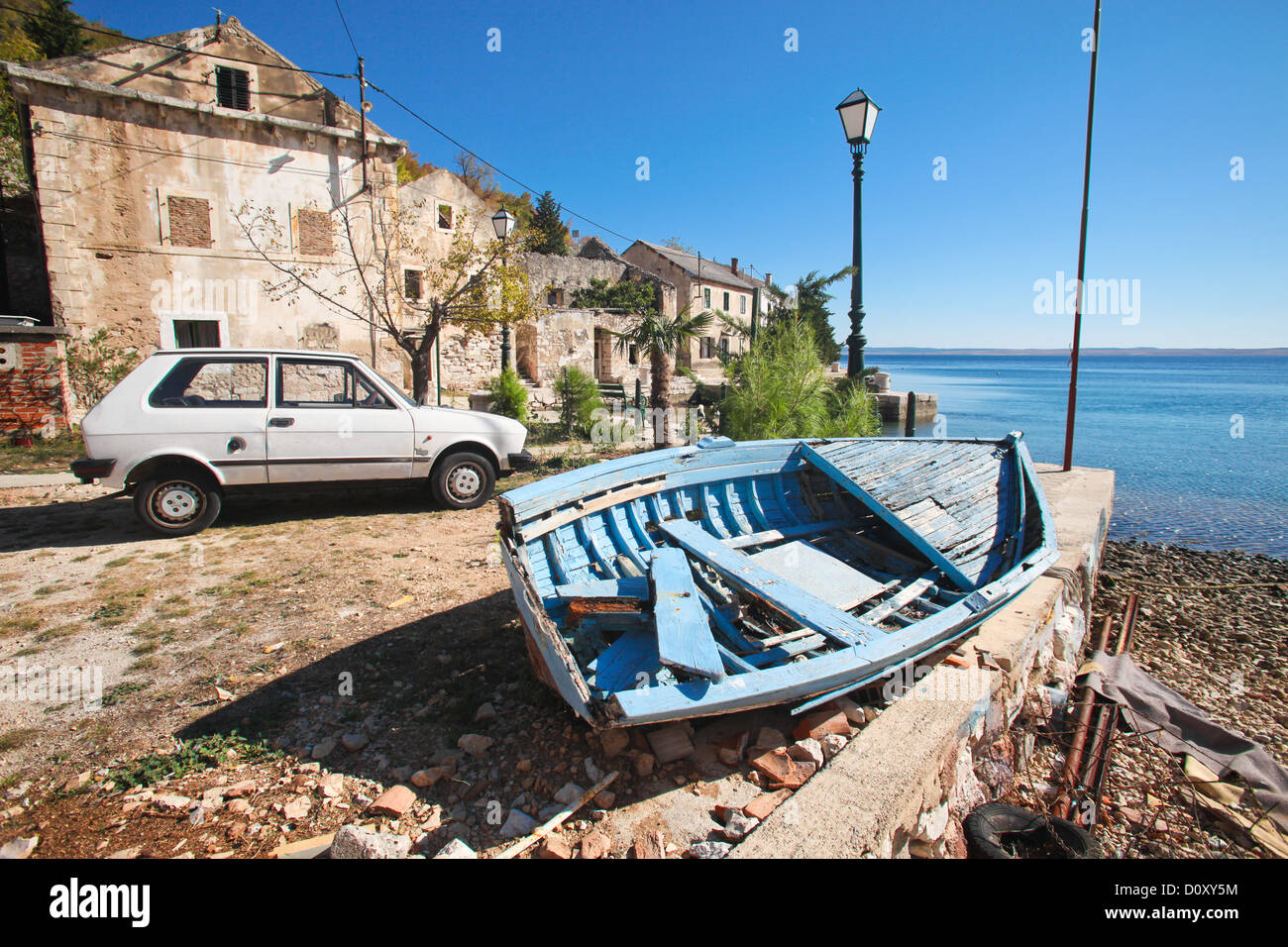 Old wooden fishing boat abandoned in little village along the coast in Croatia Stock Photo