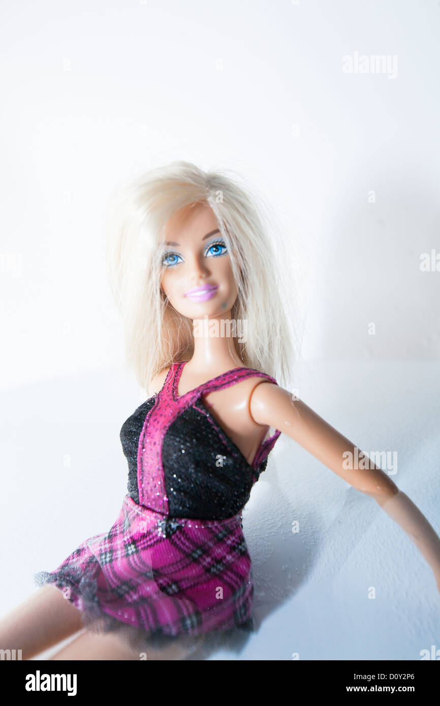 Barbie doll sitting in shallow water Stock Photo