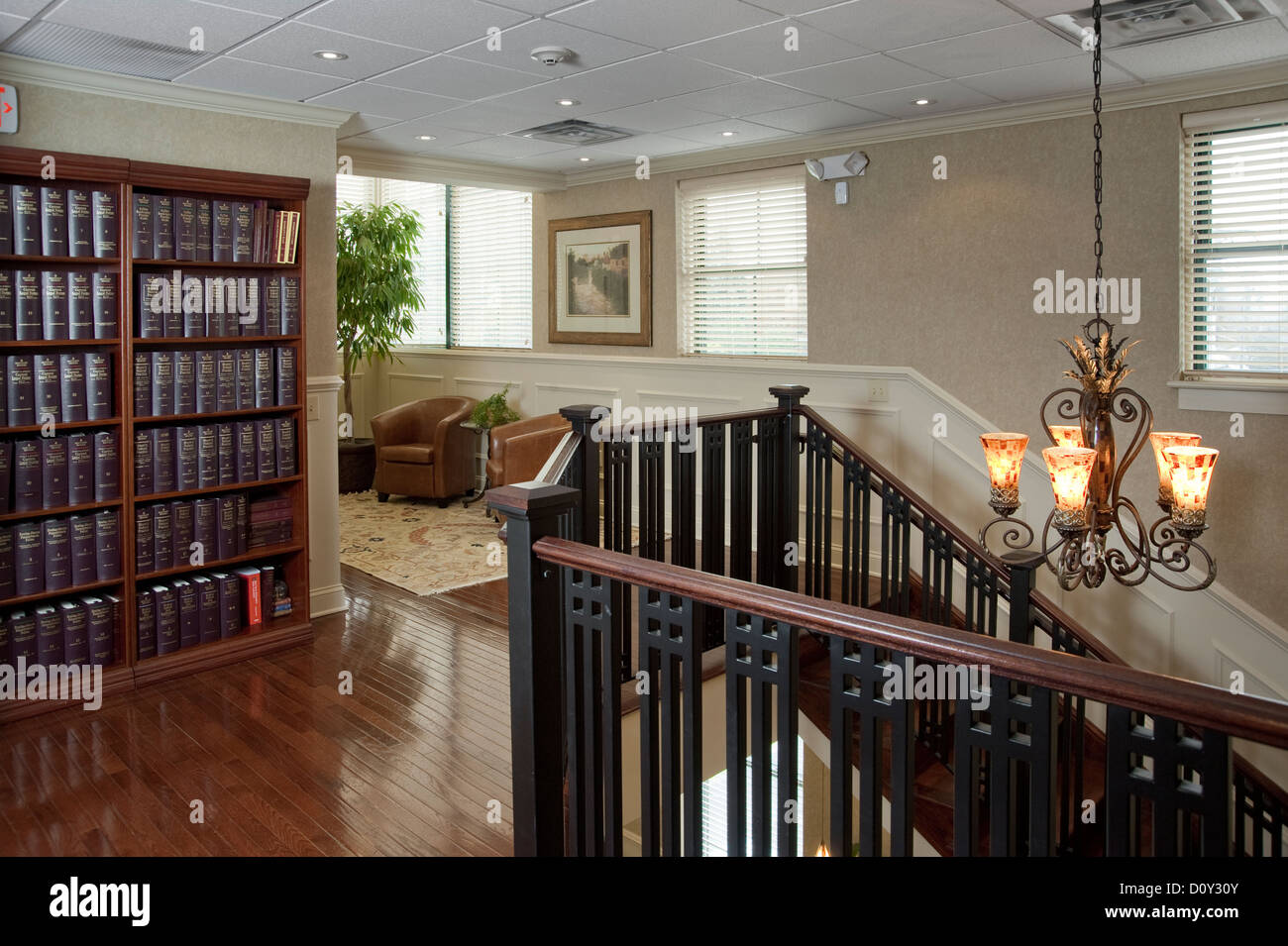 Office Interior With Book Shelf And Stairs Stock Photo