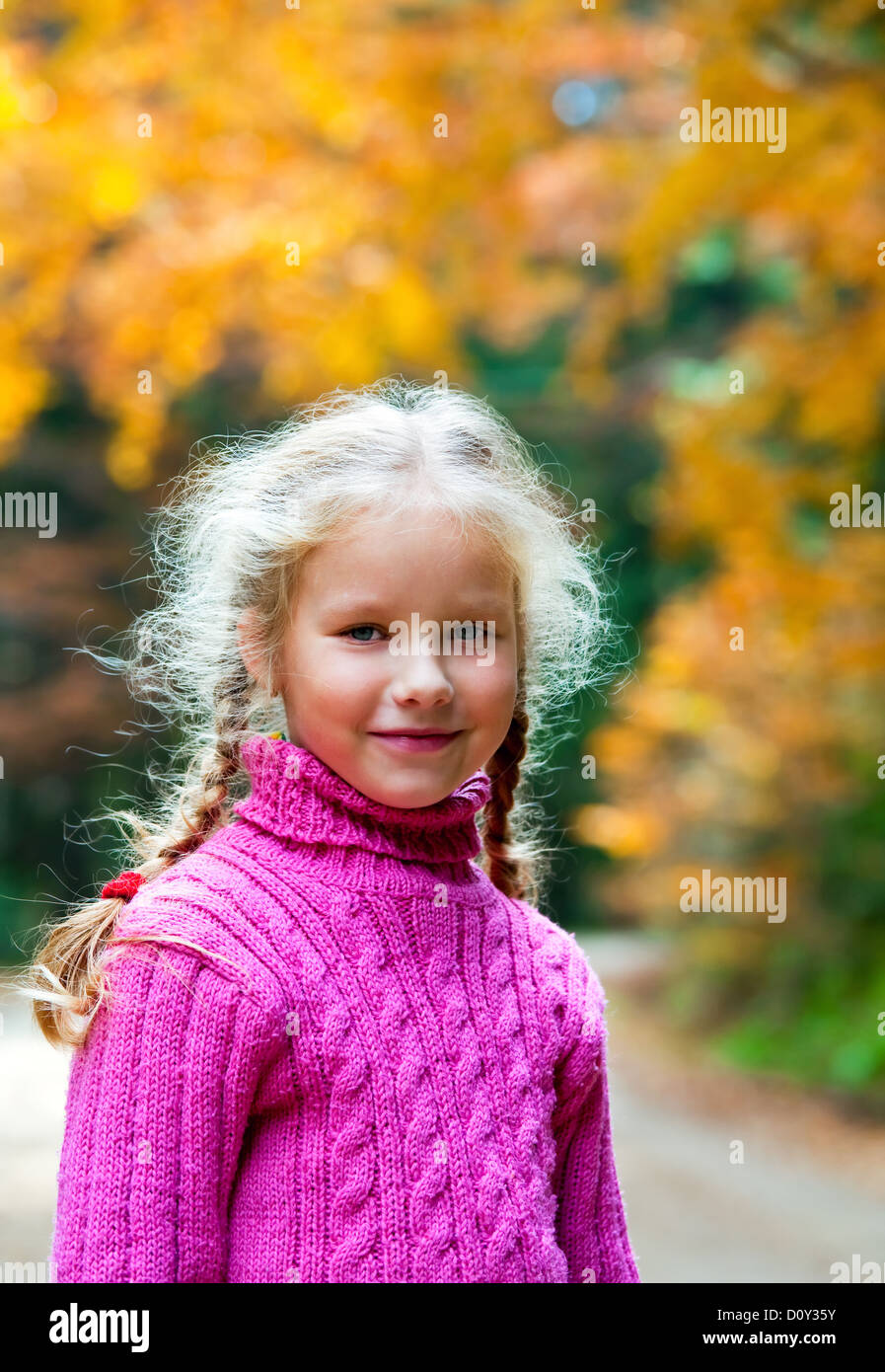 Schoolage girl autumn outdoor portrait Stock Photo