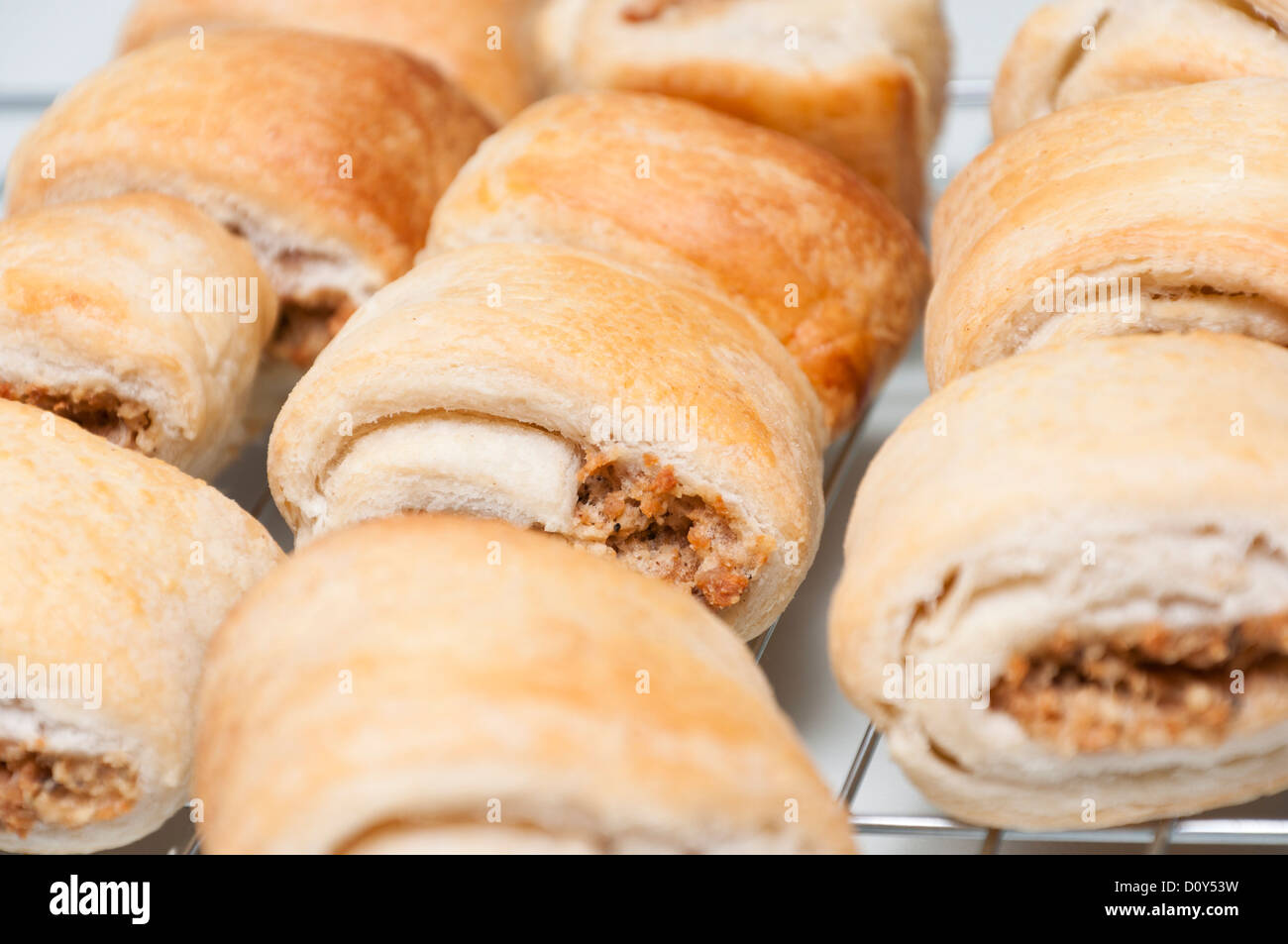 Vegetarian sausage rolls cooling on a rack. Stock Photo