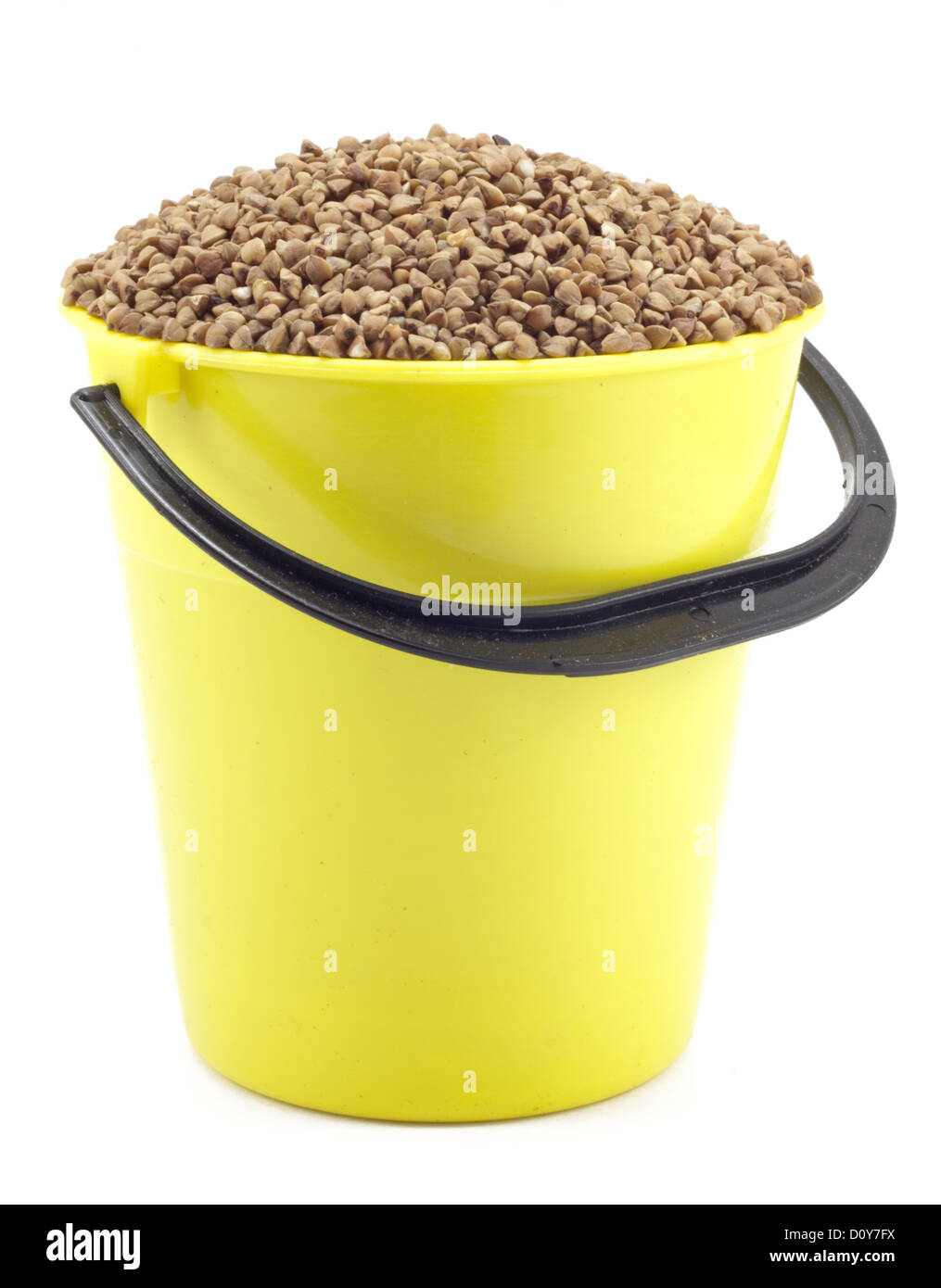 yellow bucket with buckwheat Stock Photo Alamy