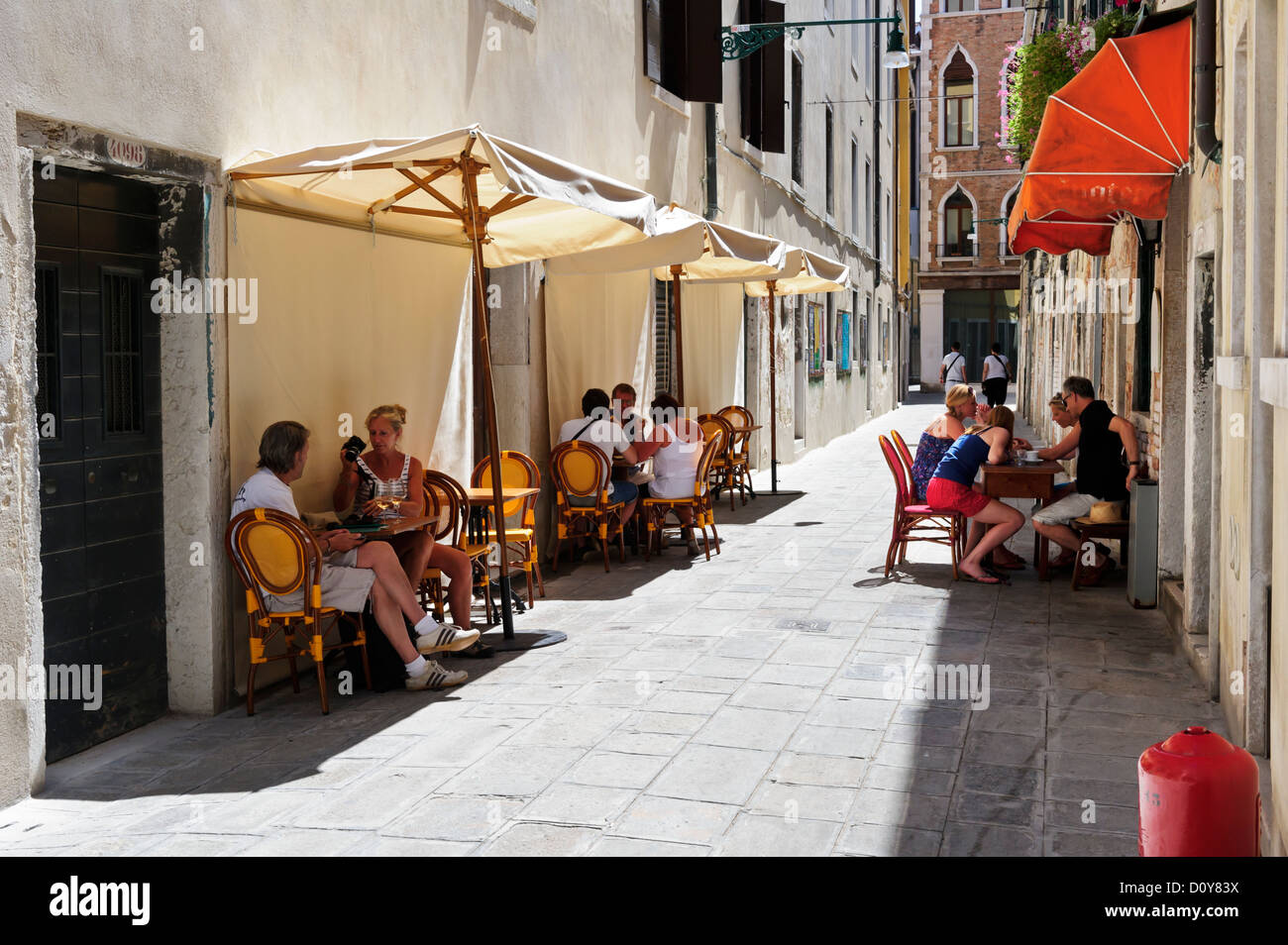 Tourists taking a break, Venice, Italy. Stock Photo