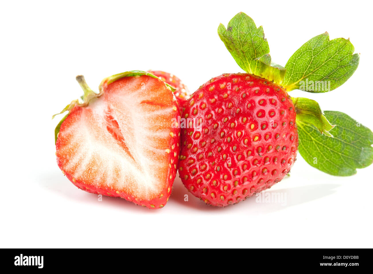 Two fresh strawberries isolated on white background Stock Photo - Alamy