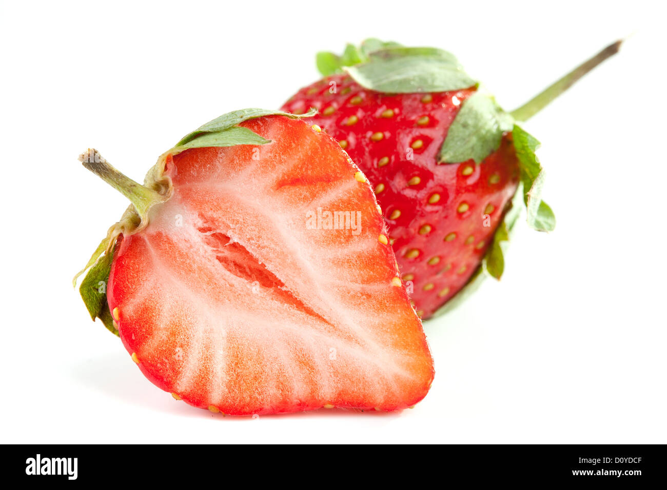 Two fresh strawberries isolated on white background Stock Photo - Alamy