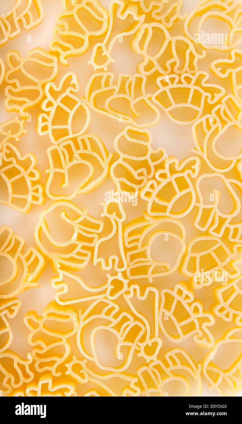 Baby pasta with animals shape: tortoise, lion, elephant, giraffe. Stock Photo