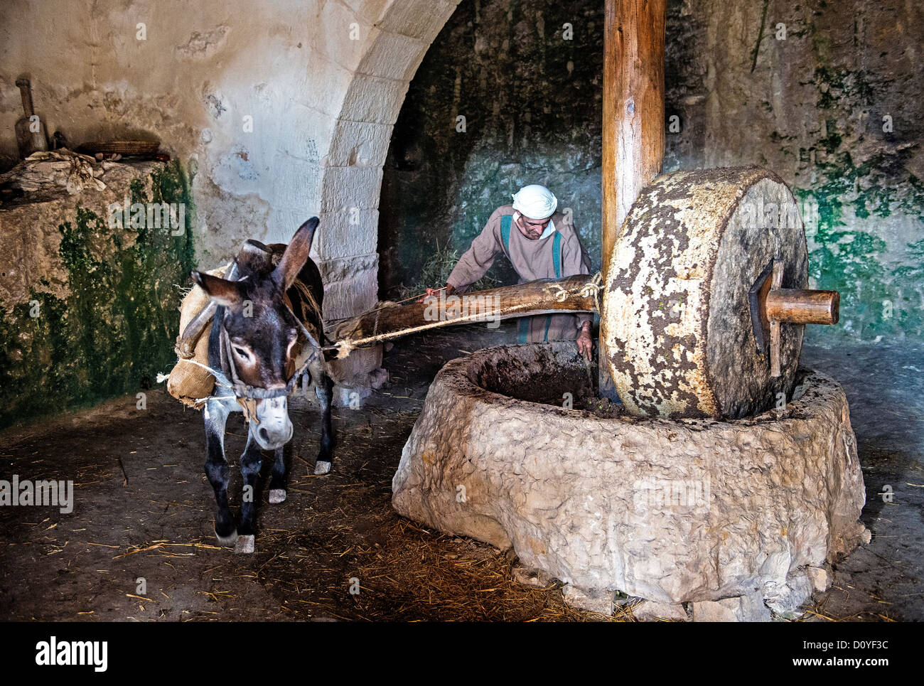 Millstone & donkey used for pressing olives to make olive oil in