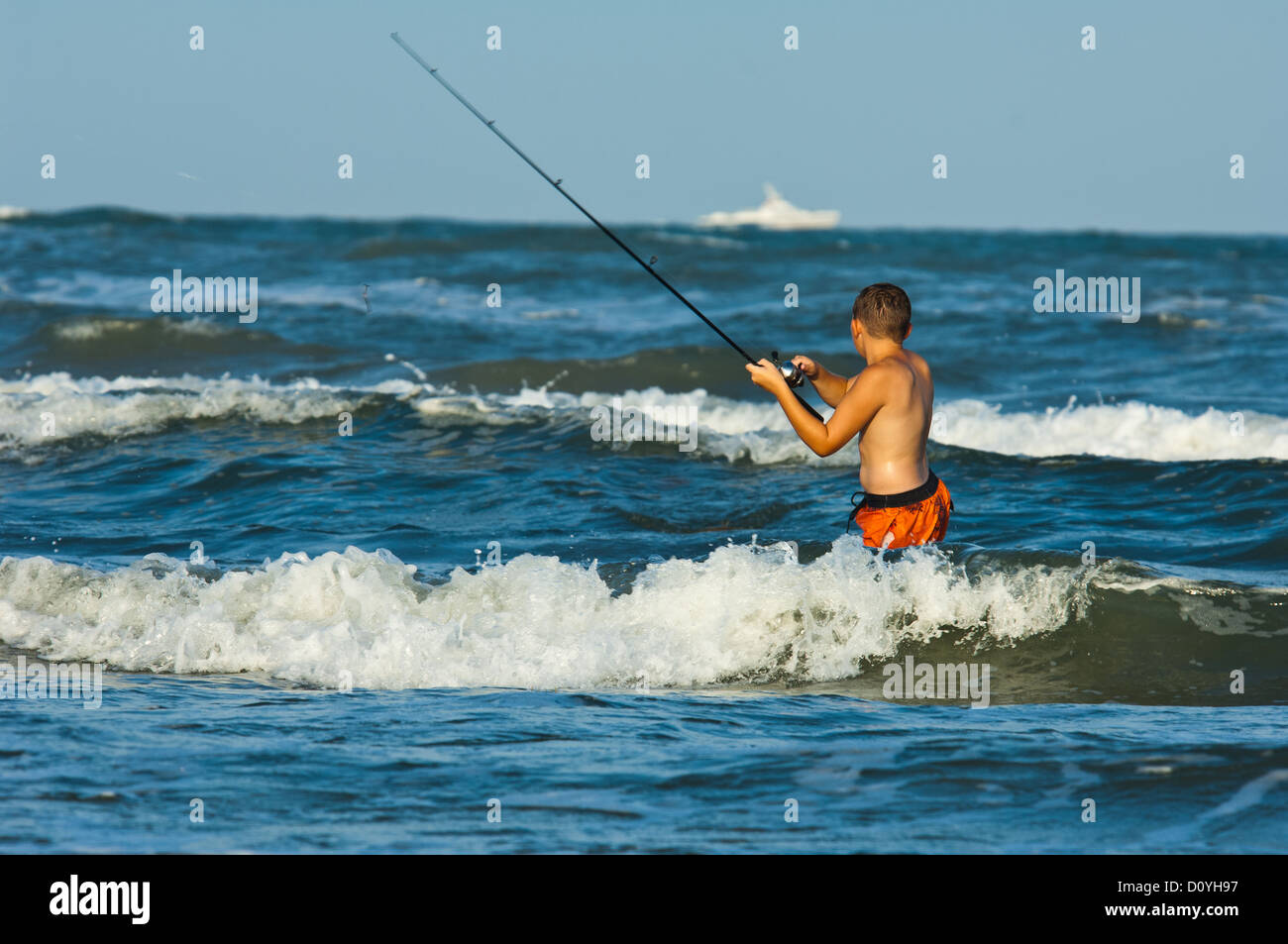 Boy fishing in the surf, Port Aransas Texas Stock Photo Alamy