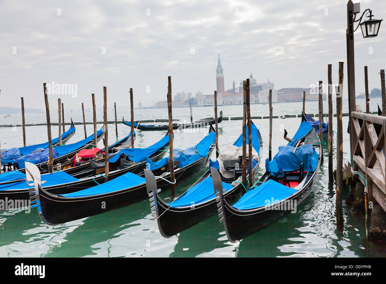 Gondolas with blue cover in Venice Stock Photo - Alamy