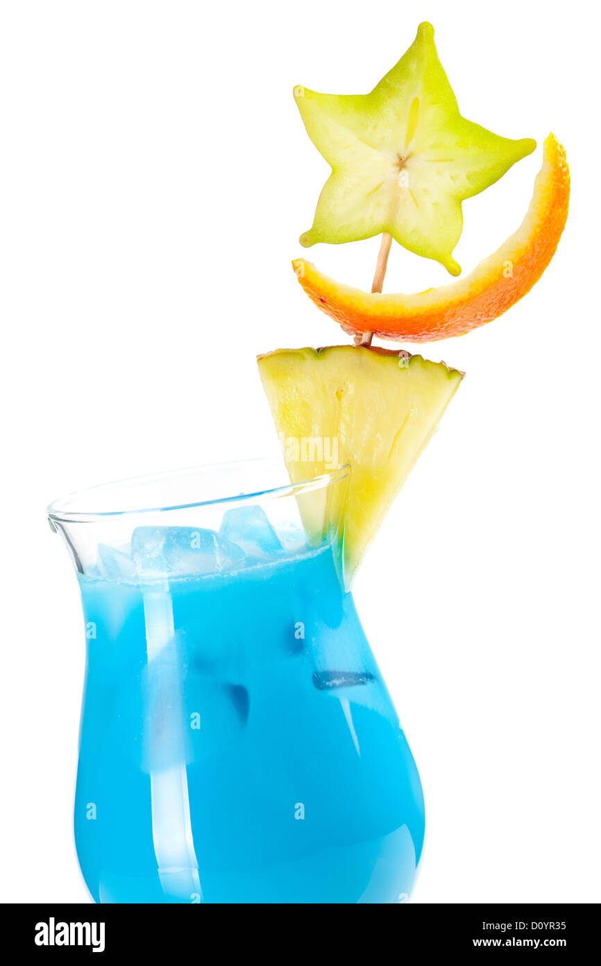 Blue Hawaii tropical cocktail with pineapple and carambola isolated on white background Stock Photo