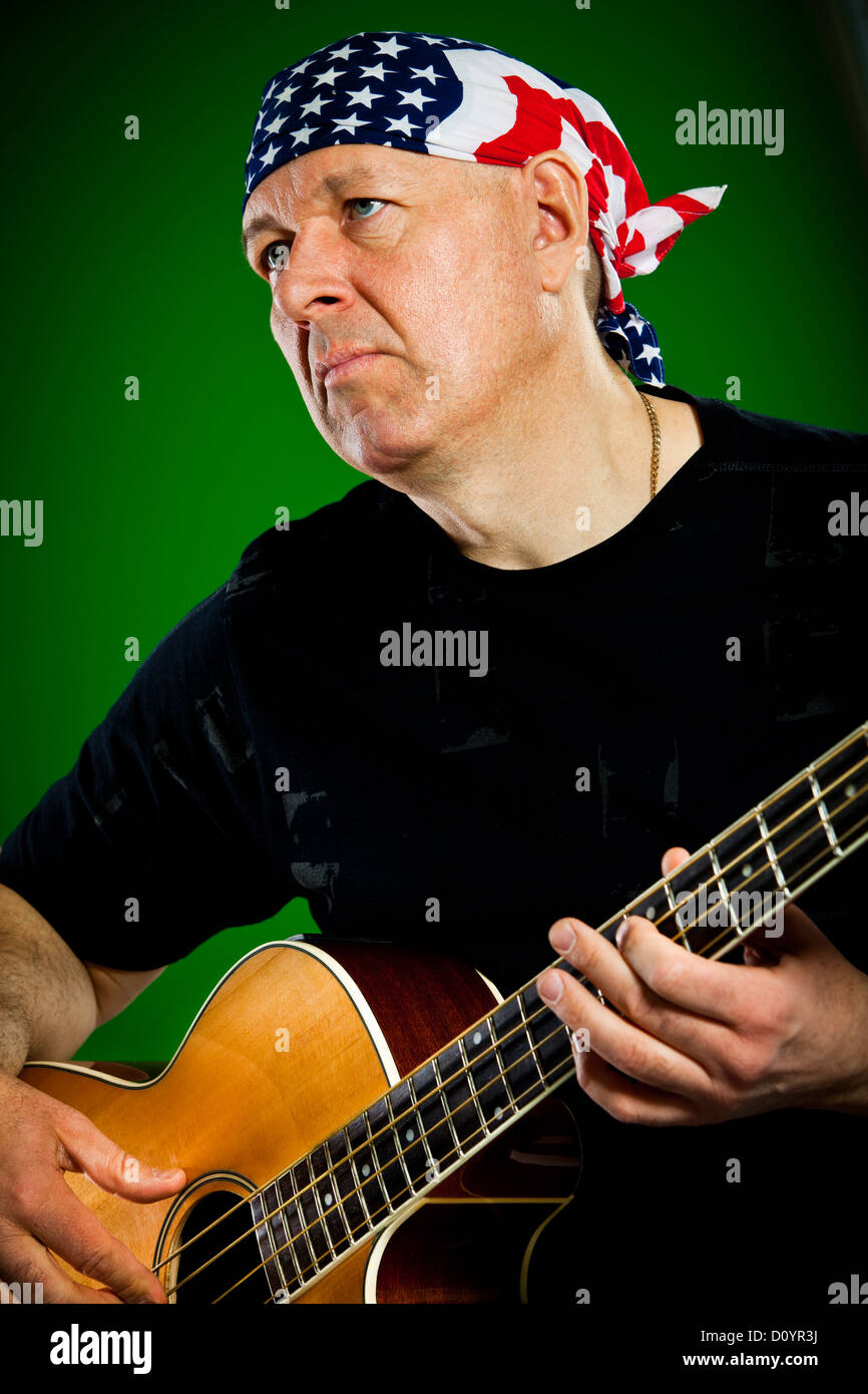 man with a guitar, bass player Stock Photo