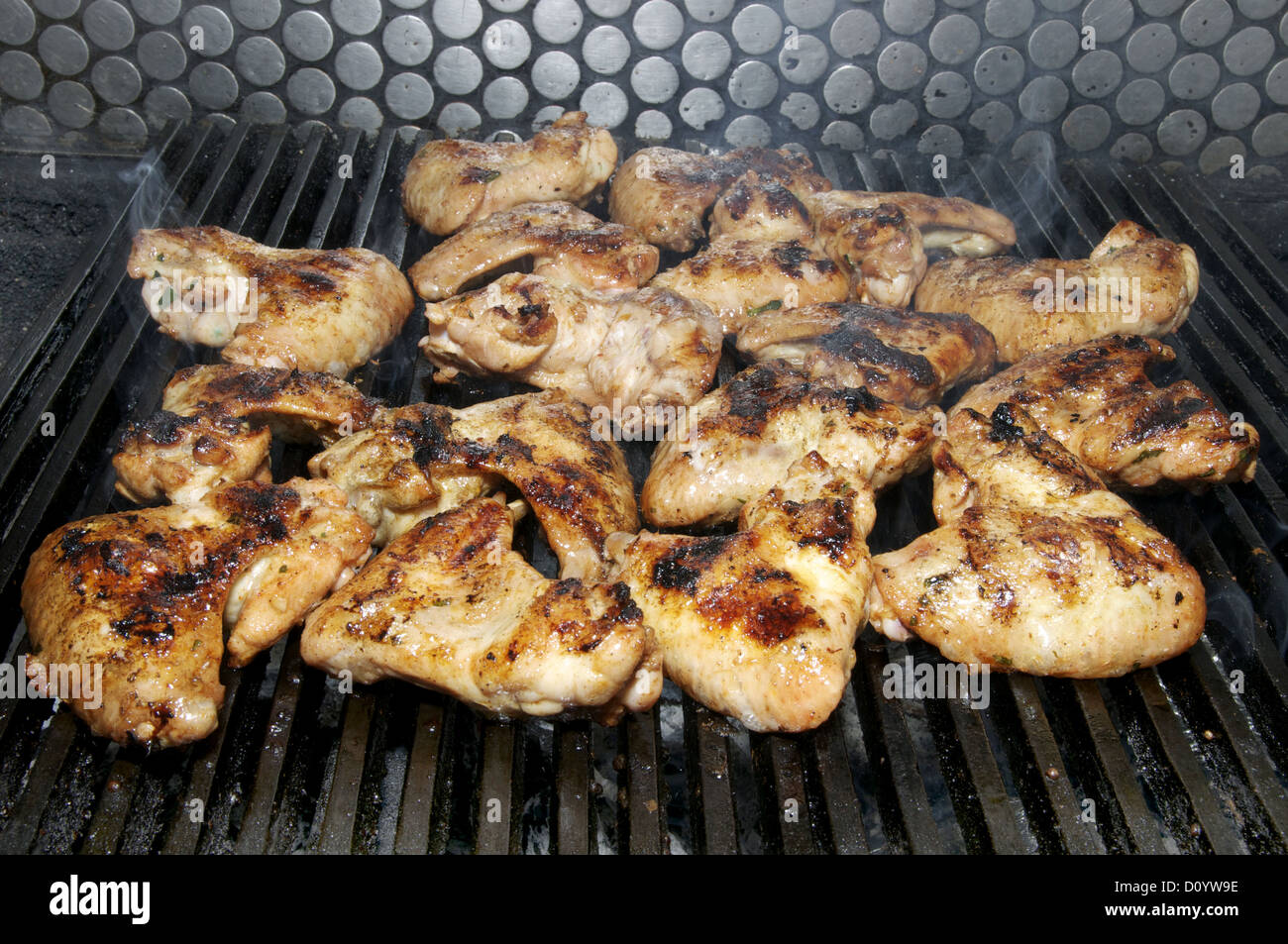 wings on the grill Stock Photo Alamy