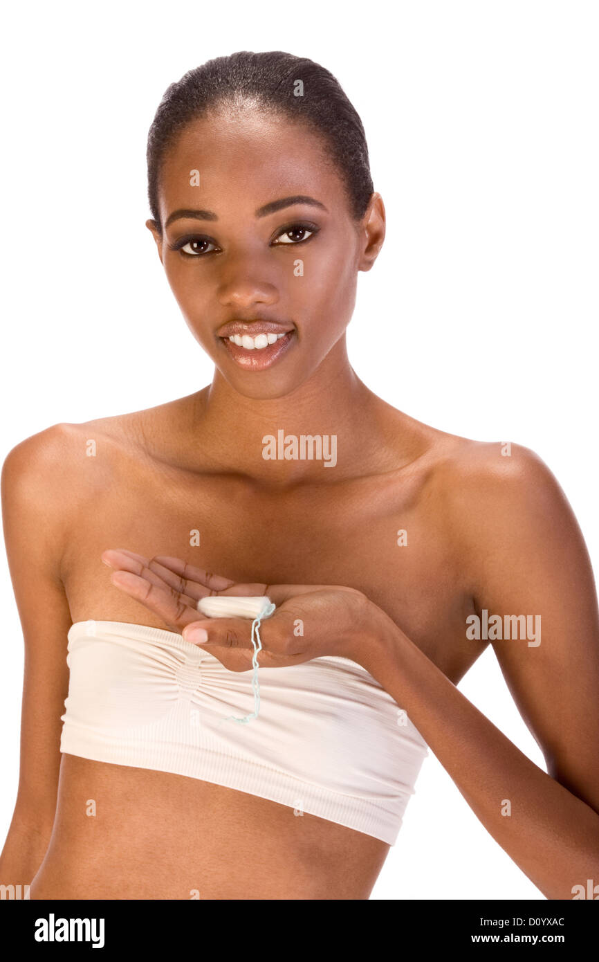 African-American ethnic woman holding white tampax vaginal cotton tampon Stock Photo
