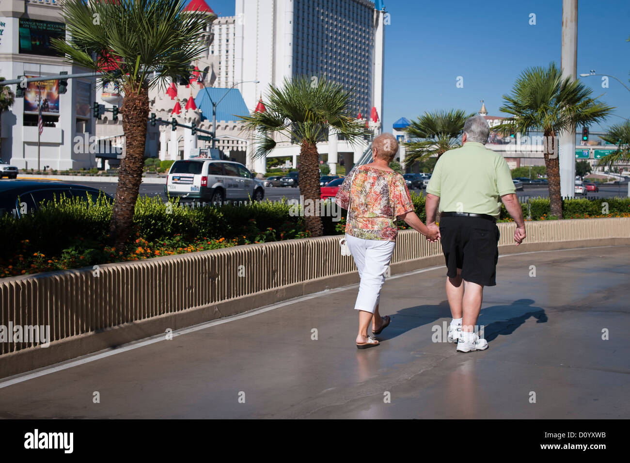 An older couple walk hand in hand, Las Vegas Stock Photo