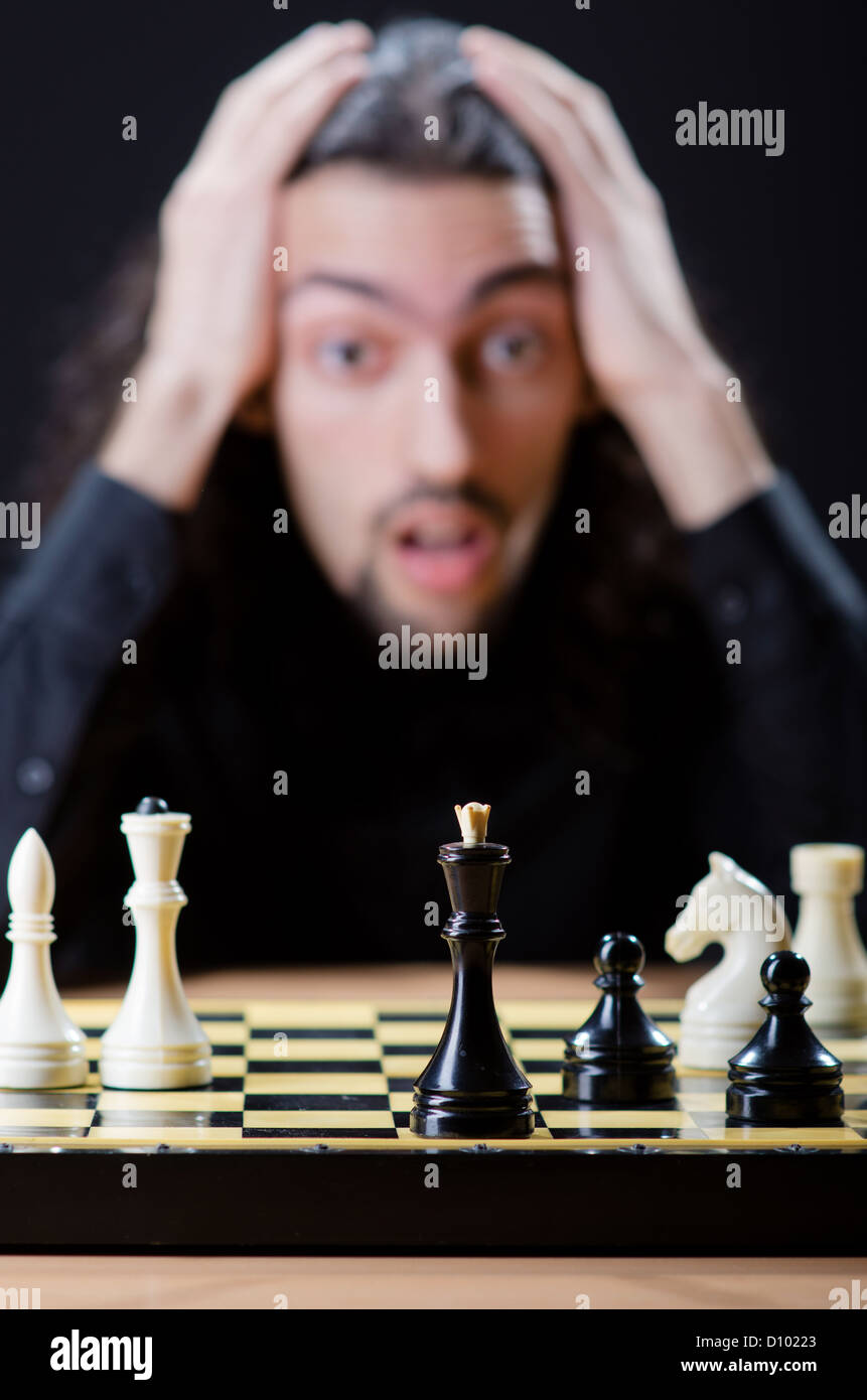 Chess player playing his game Stock Photo