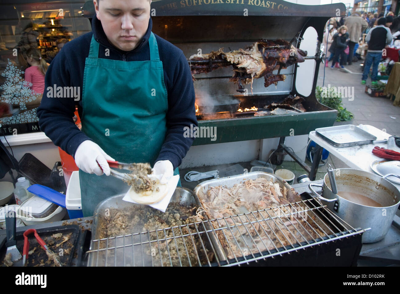 Spit roast pig stall Christmas street fair Woodbridge, Suffolk, England Stock Photo