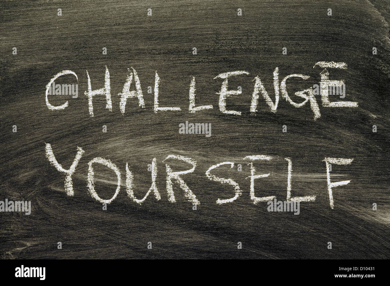 challenge yourself phrase handwritten on school blackboard Stock Photo