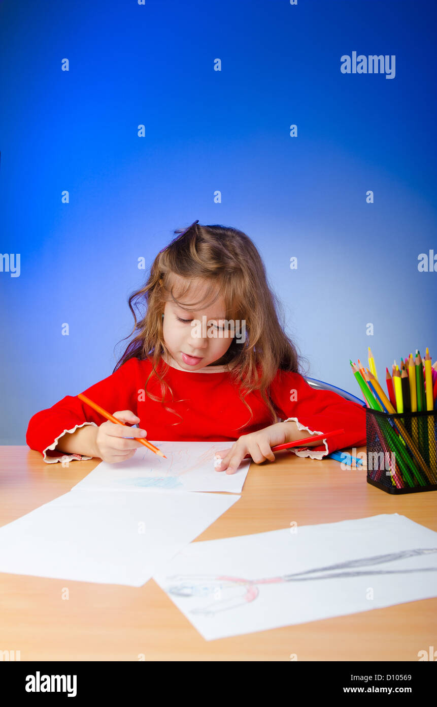 Little girl drawing with pencils Stock Photo - Alamy