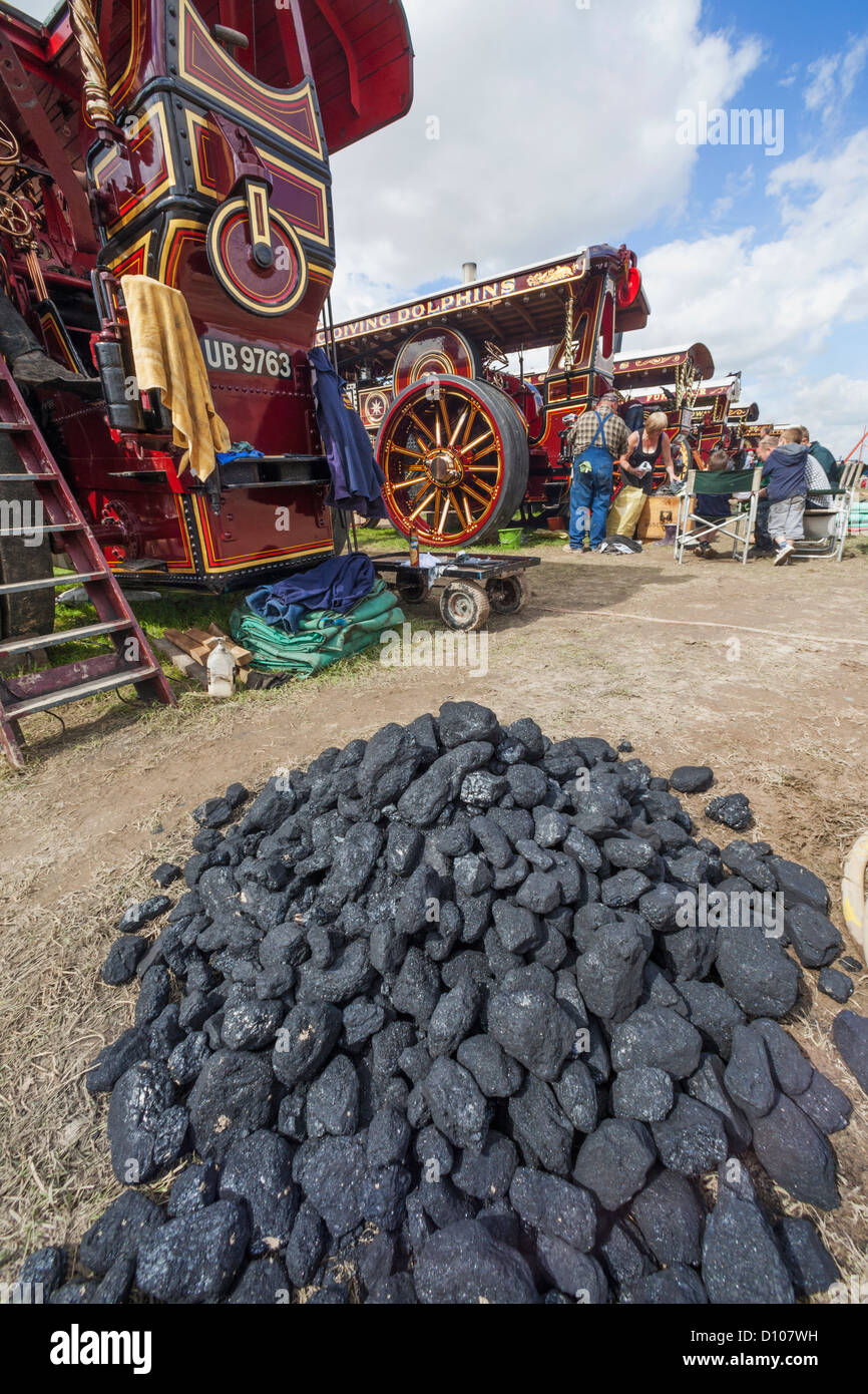 England, Dorset, Blanford, The Great Dorset Steam Fair, Coal Pile and Steam Engines Stock Photo