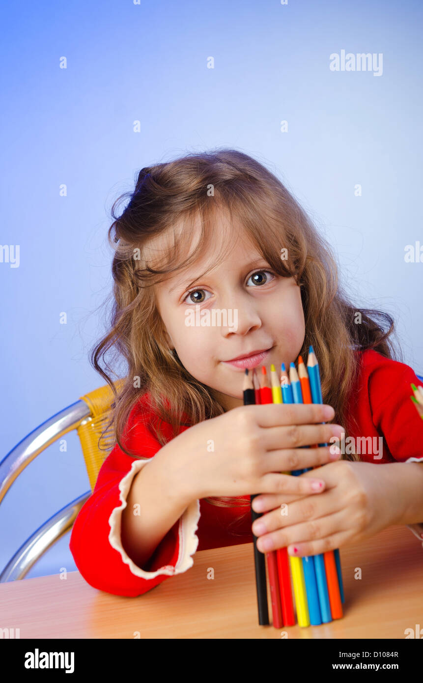 Little girl drawing with pencils Stock Photo - Alamy