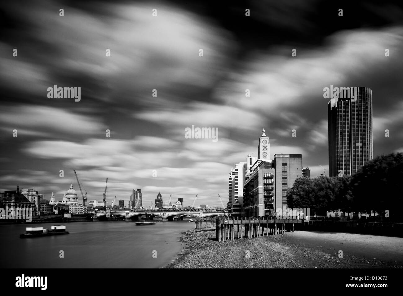 The OXO Tower viewed from upstream of the River Thames with Sea Containers House and the City Of London and Gherkin building bey Stock Photo