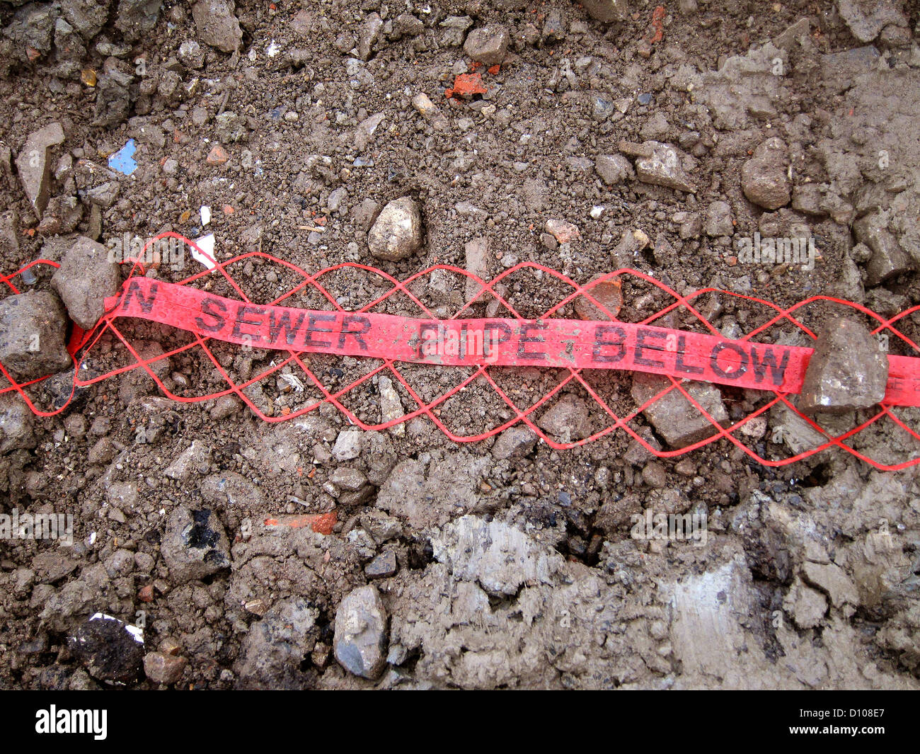 Red marker tape for a sewer pipe trench to prevent damage during later