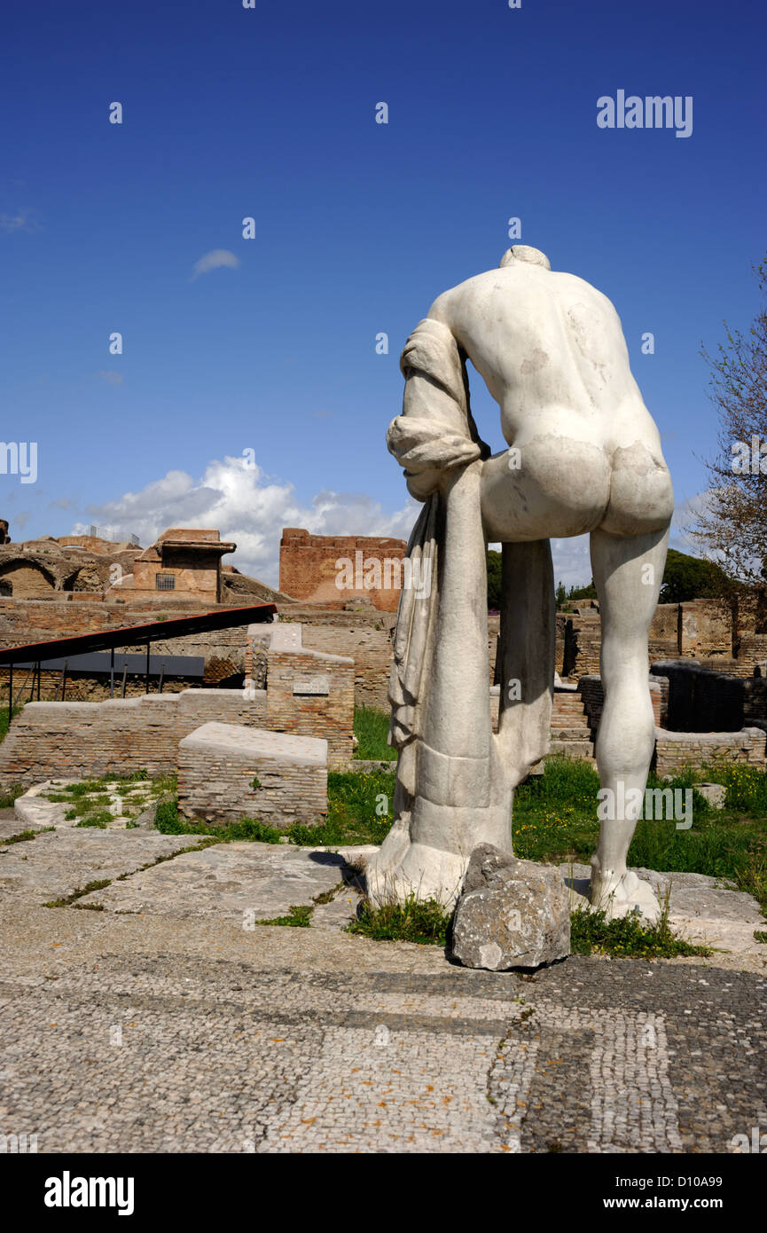 Italy, Rome, Ostia Antica, headless roman statue of Cartilius Poplicola in the area of the republican temples, temple of Hercules Victor Stock Photo
