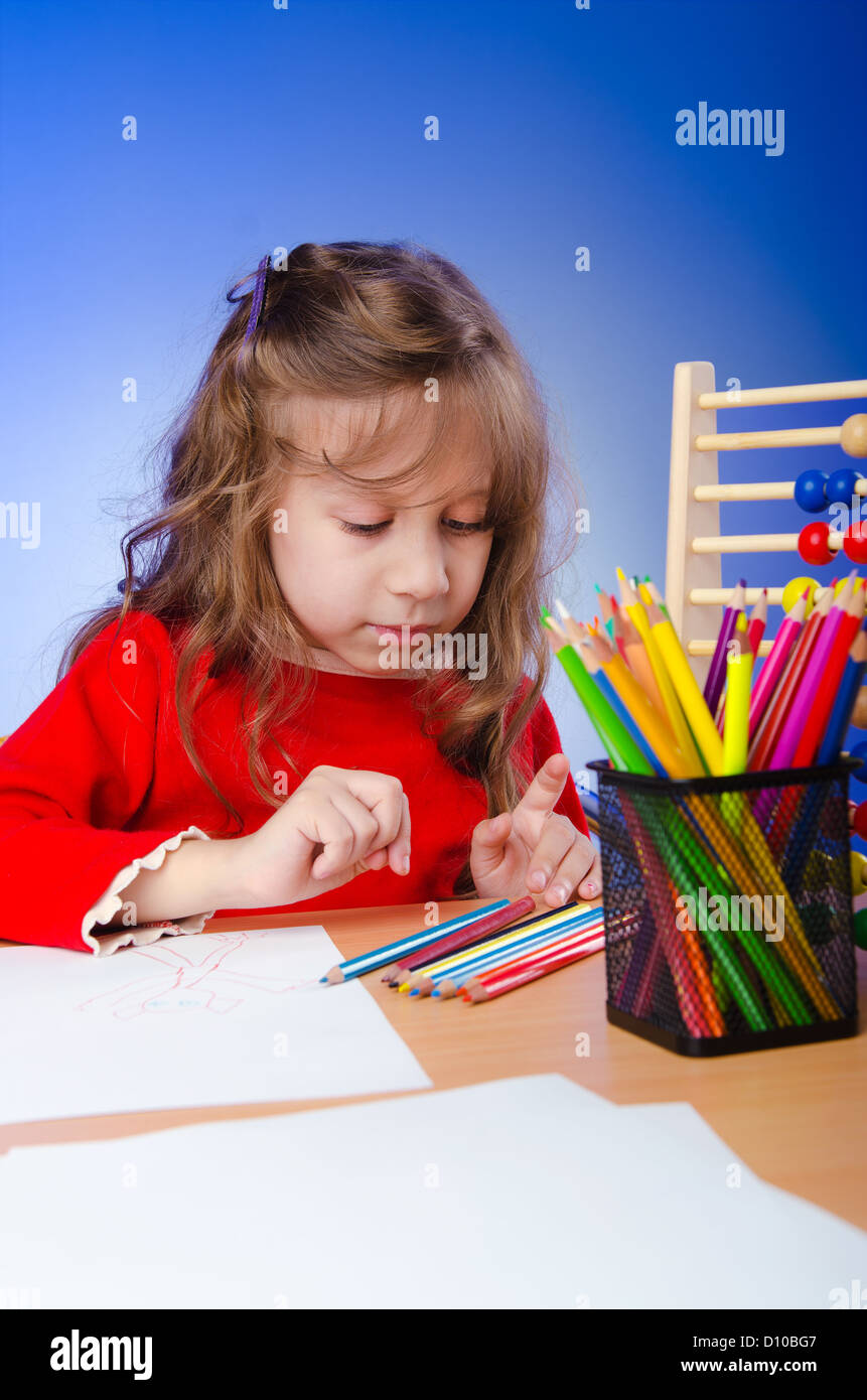 Little girl drawing with pencils Stock Photo - Alamy