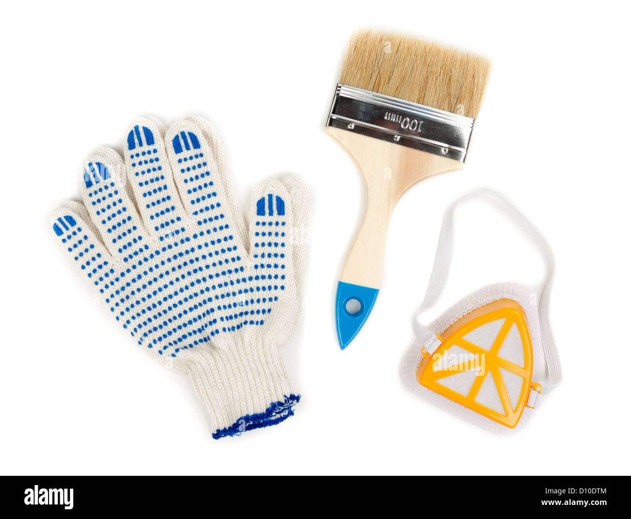 Still a pair of cotton gloves, paint brush and a dust mask Stock Photo