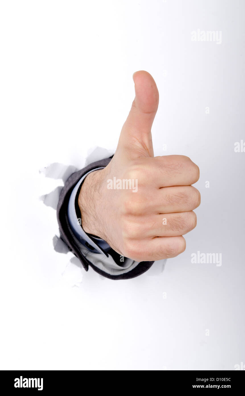 Hand through the hole in paper Stock Photo - Alamy