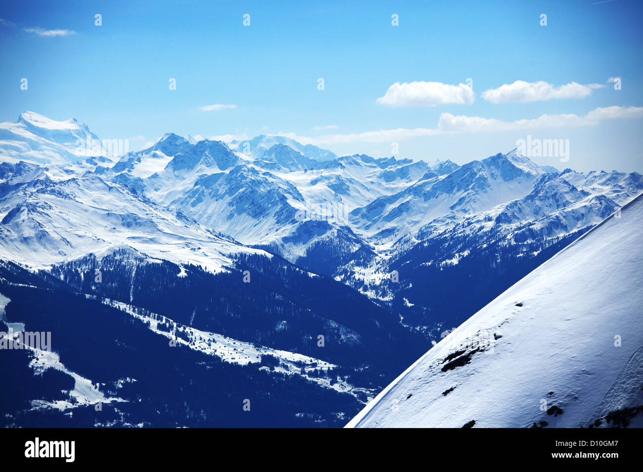 top of mountains in blue sky Stock Photo Alamy