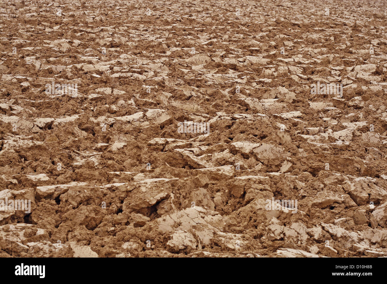 brown clods of earth in a field just plow by a farmer Stock Photo - Alamy