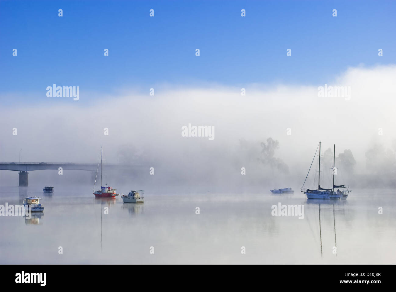 Boats on a foggy river Stock Photo