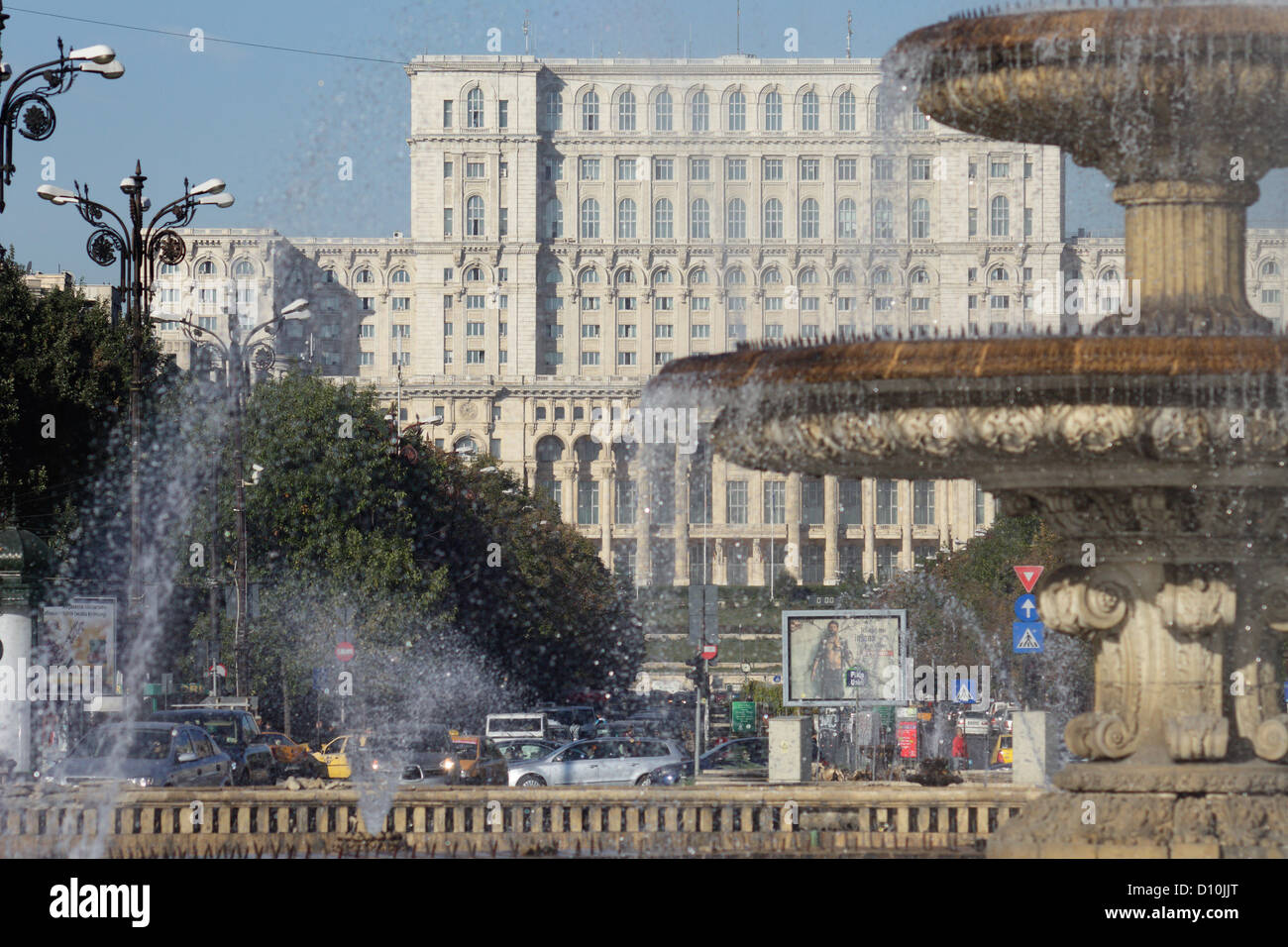 Bucharest, Romania, fountains in the square of the unit, in the background of the Palace of the Parliament Stock Photo