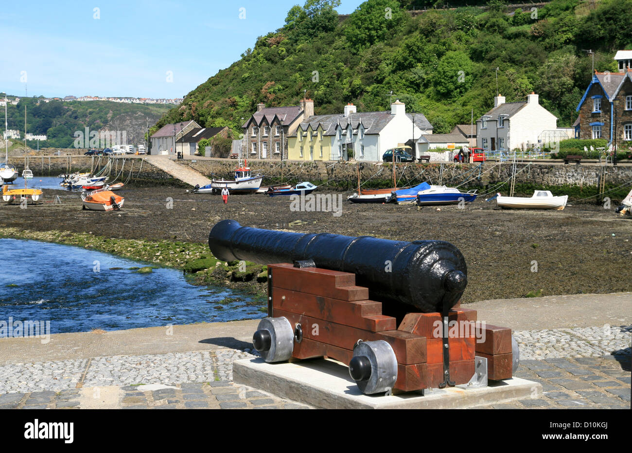 harbour and cannon Lower Fishguard Pembrokeshire Wales UK Stock Photo