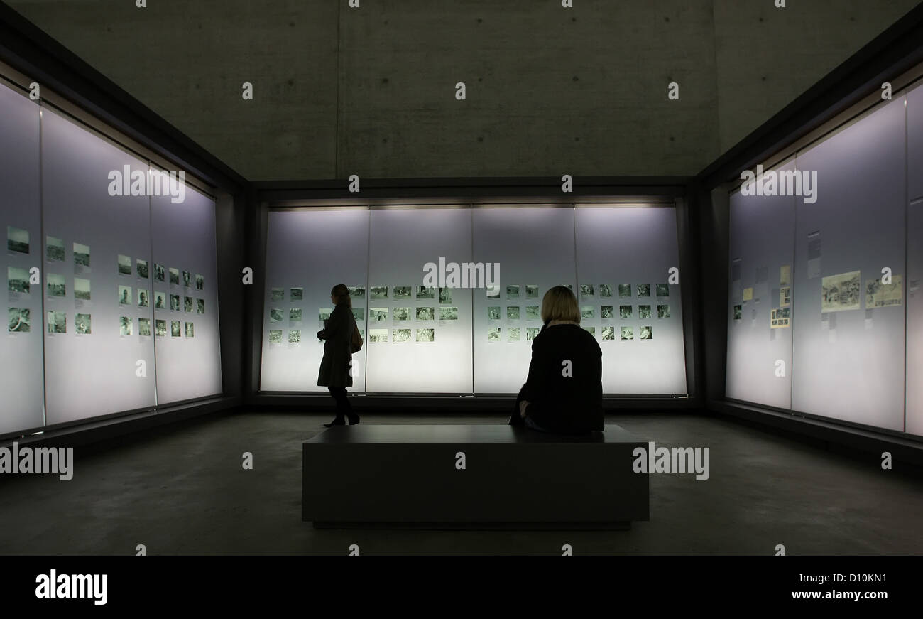 (dpa FILE) - An archive picture, dated 27 October 2007, shows visitors walking in side the documentation centre of the Bergen-Belsen memorial site near Lohheide, Germany. The lack of public awareness in Germany concerning the crimes committed by the Nazi regime was common at the time when the former Bergen-Belsen concentration camp was founded as a memorial site 60 years ago. Since then, more than eight million people have visited the site where more than 70 000 prisoners of war and concentration camp prisoners where murdered. Photo: Peter Steffen Stock Photo