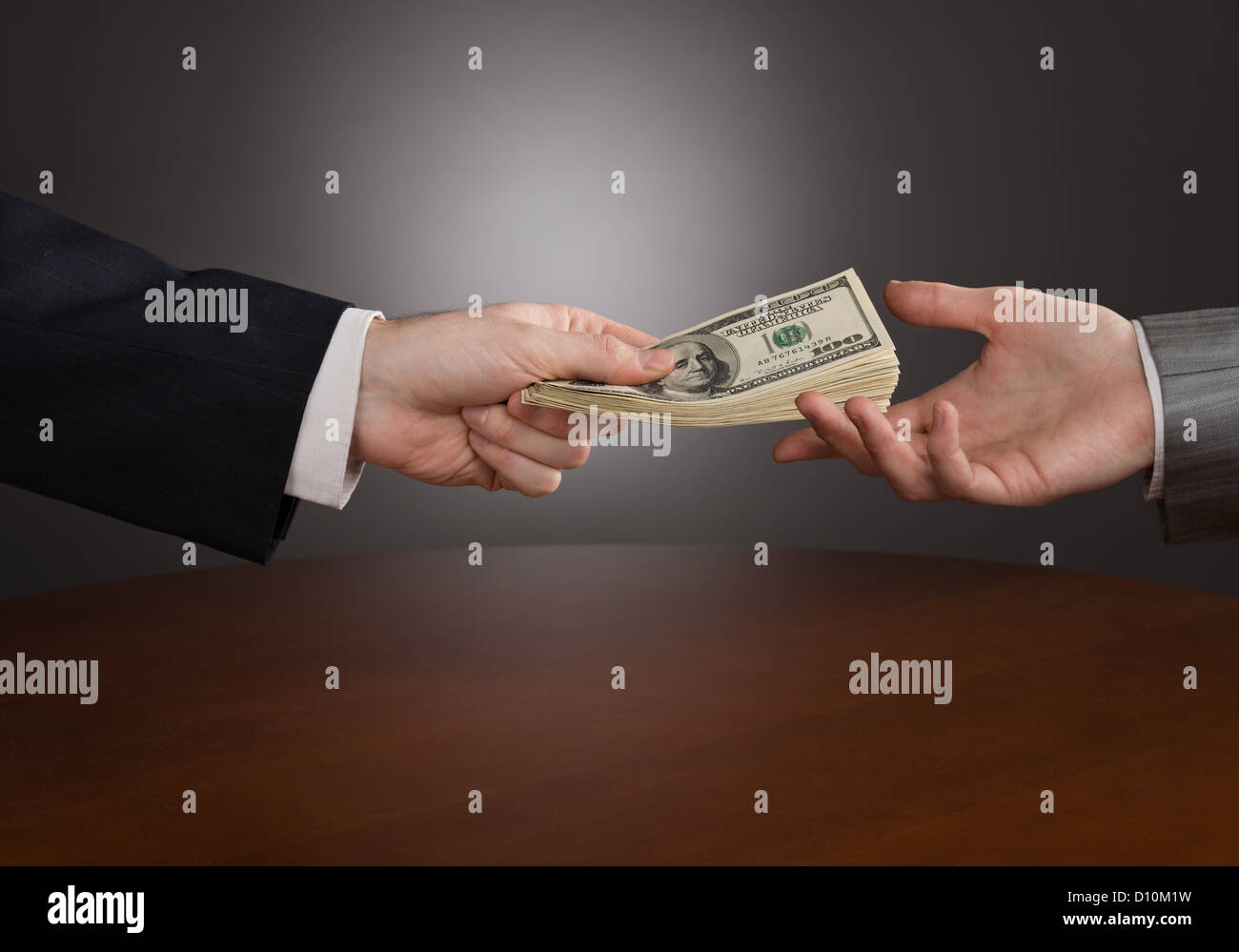 one-businessman-giving-money-to-another-stock-photo-alamy