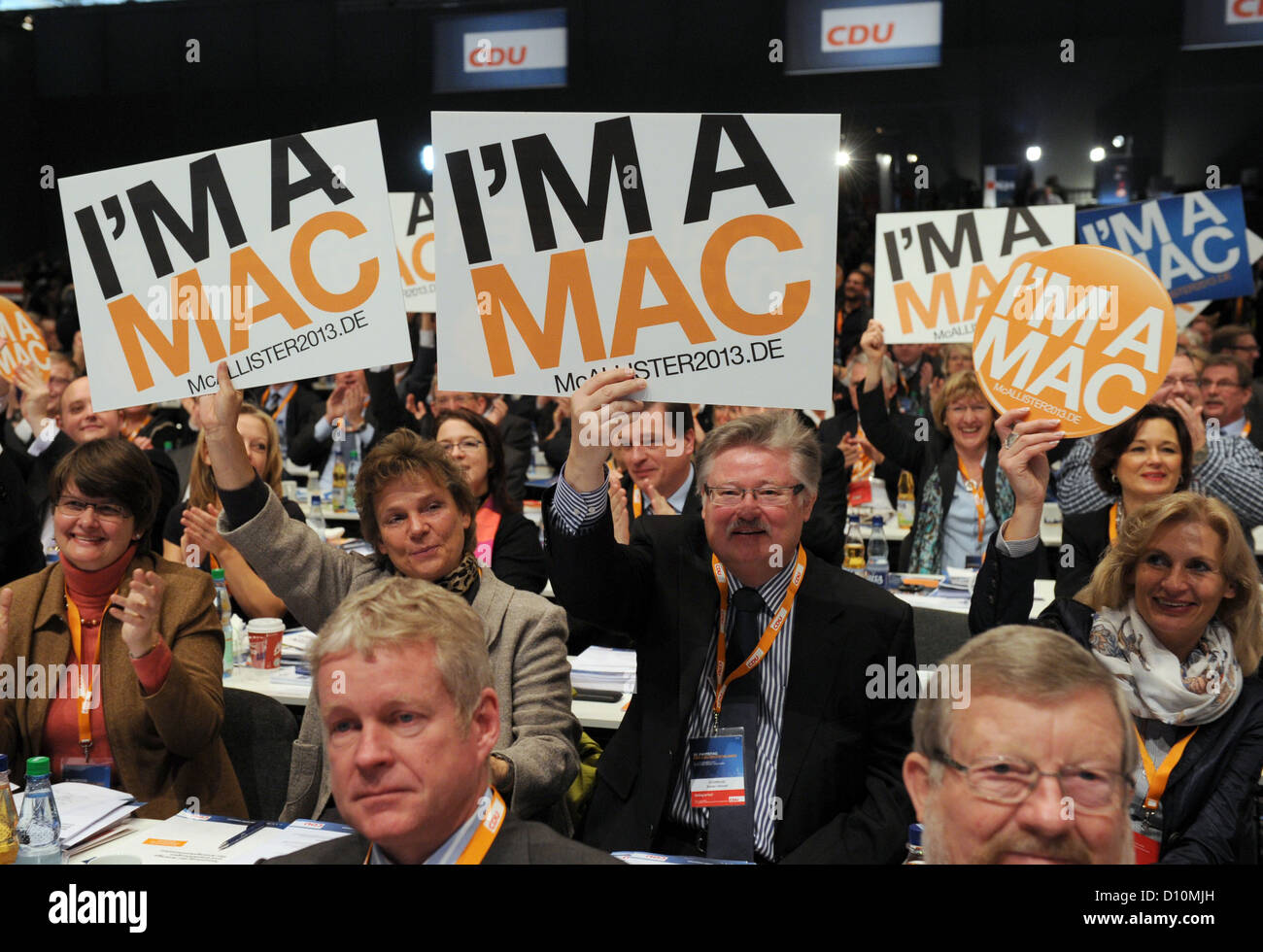 Delegates hold campagin signs in favour of Lower Saxony's Premier, David McAllister, in thair hands during the 25th Federal Party Convention of the Christian Democrats (CDU) is taking place in Hanover, Germany, 4 December 2012. Photo: Jochen Luebke Stock Photo