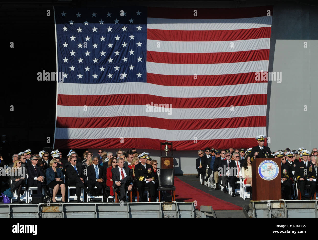 Chief of Naval Operations (CNO) Adm. Jonathan W. Greenert delivers remarks during the inactivation ceremony for the aircraft carrier USS Enterprise (CVN 65). Enterprise was commissioned Nov. 25, 1961 as the first nuclear-powered aircraft carrier. The inac Stock Photo