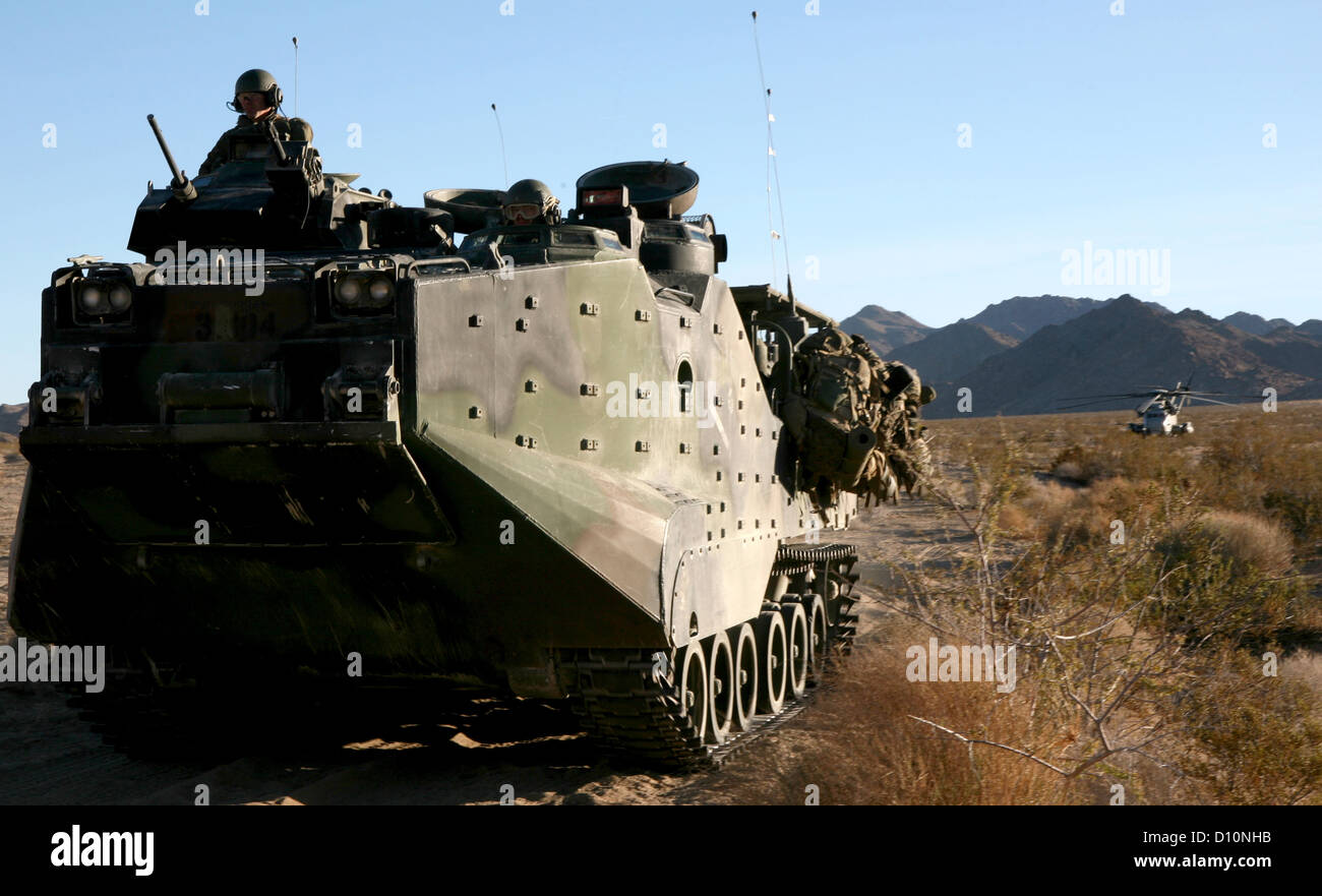 Marines with 3rd Assault Amphibian Battalion, 1st Marine Division, drive their amphibious assault vehicle away from a resupply point where they picked up equipment dropped off by CH-53E's during Exercise Steel Knight, Dec. 9, 2008 Stock Photo